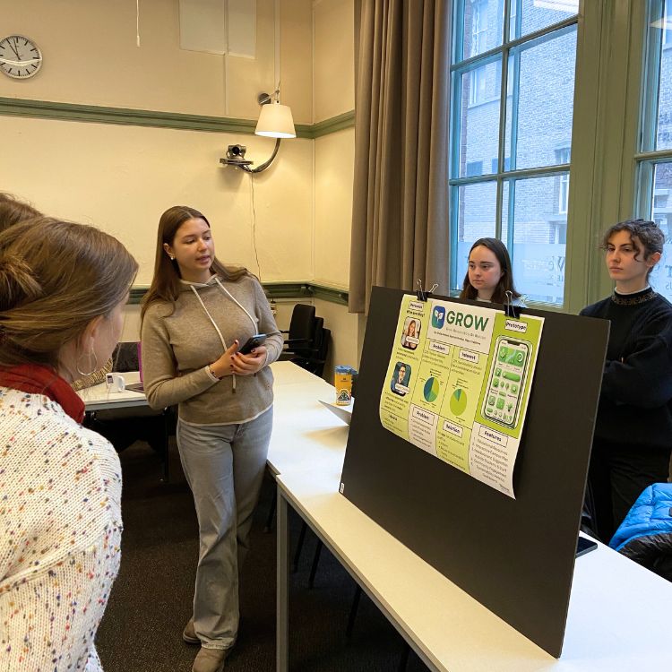 Students present their project on improving campus sustainability.